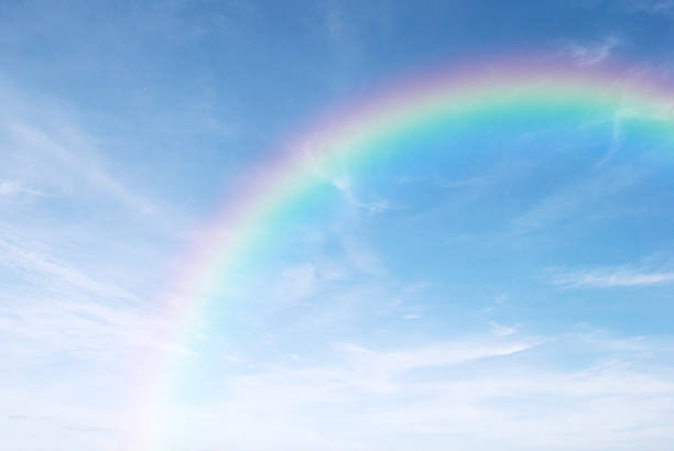istock rainbow in the clear blue sky after the rain 504755996