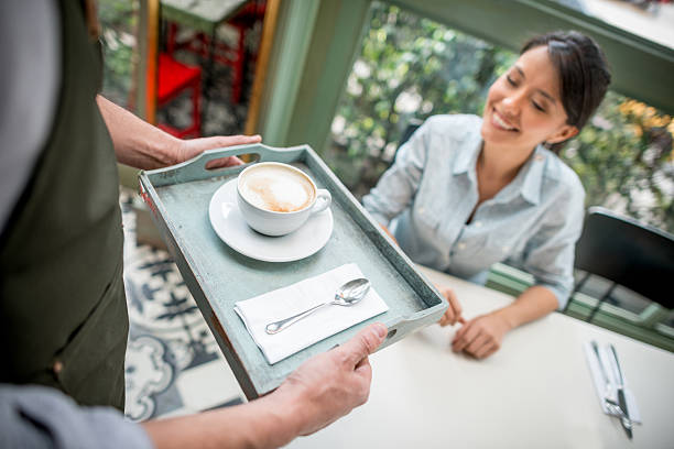 istock Woman having a cup of coffee at a cafe 504756832