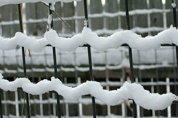 istock Wavy snow on fence 504757168