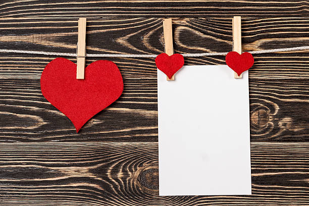 istock Pins, red hearts, blank card on wooden background 504758108