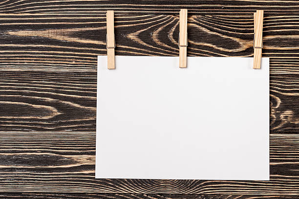 istock Pins, blank card on wooden background 504758134