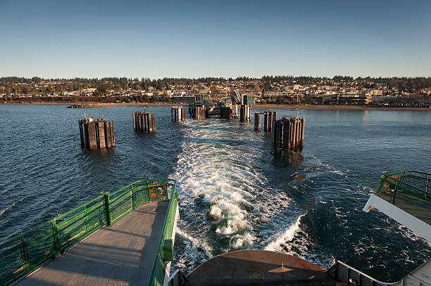 Edmonds, Washington Ferry Dock A ferry boat pull out of the ferry dock traveling to Kingston on Bainbridge Island in the Puget Sound area of western Washington state. edmonds stock pictures, royalty-free photos & images