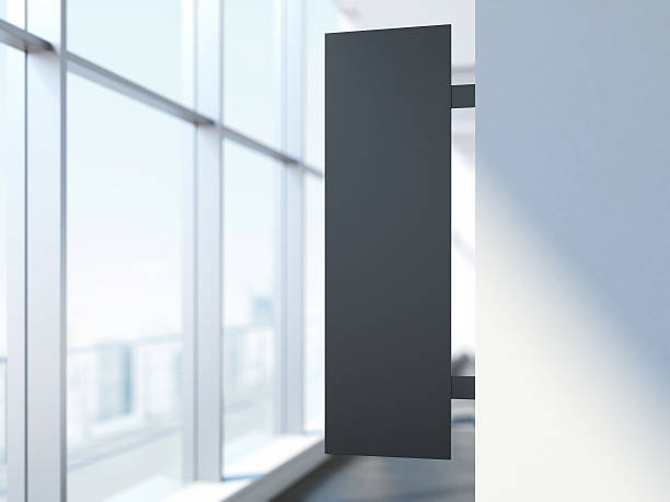 istock Black vertical signboard in the office interior 504779970