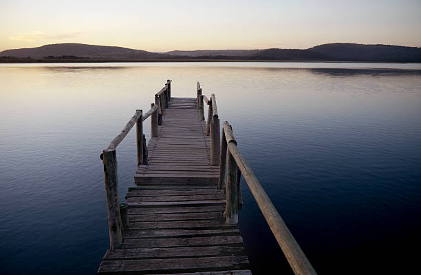 istock old wooden jetty over a river 504782151