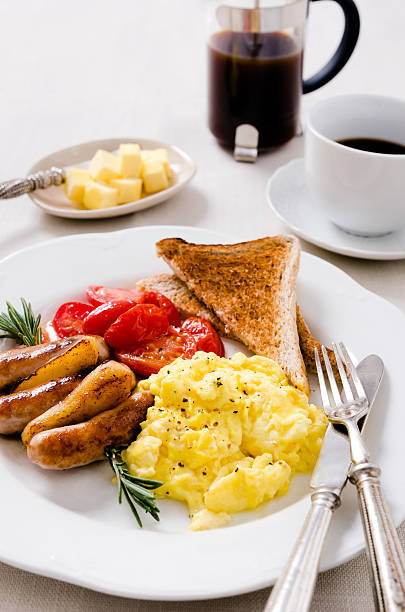 istock Scrambled egg breakfast with sausages, tomatoes and coffee 504783899