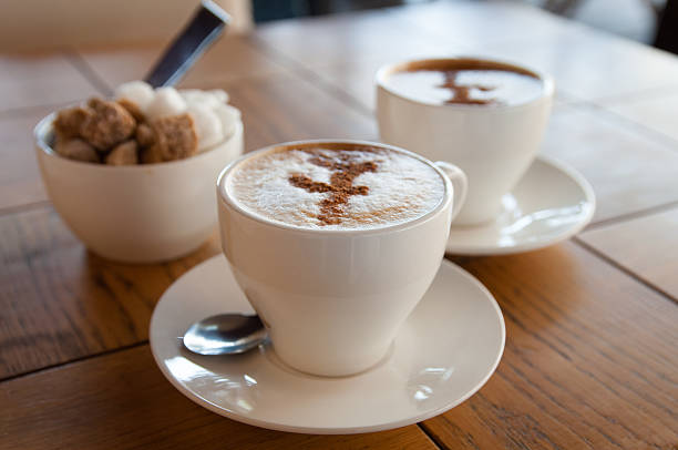 istock cups of coffee and sugar 504786383
