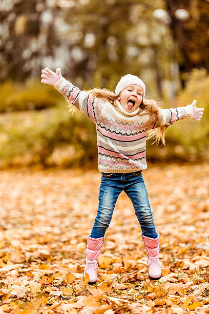 istock Girl autumn walk 504786476