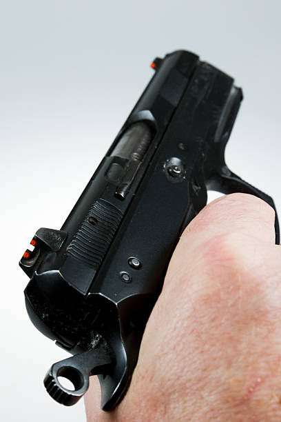 istock man pointing a weapon and weapon charges 504787036