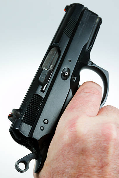 istock man pointing a weapon and weapon charges 504787178