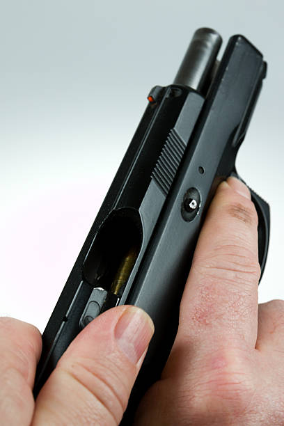 istock man pointing a weapon and weapon charges 504787282