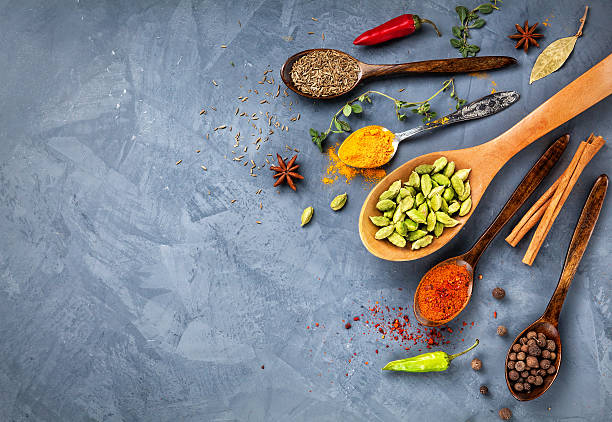 istock Various Spices near blackboard at blue stone background 504787366