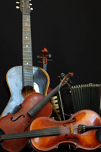 istock violin guitar and accordion still life 3 504787521