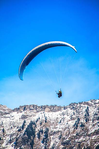 istock Paragliding fly over the Alps 504787706