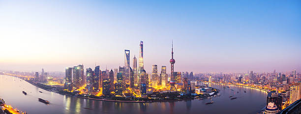 istock waterfront cityscape and illuminated skyline at dawn 504788298