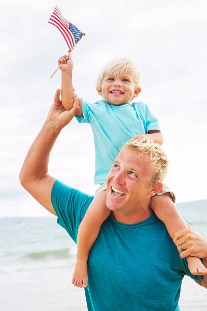 istock Father and son playing on the beach 504788497