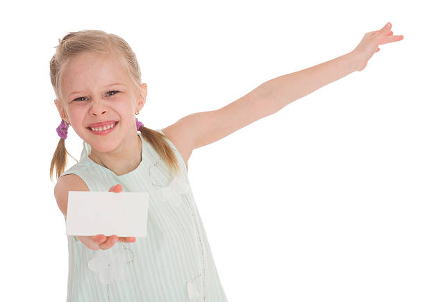 istock cheerful little girl with white blank 504788879