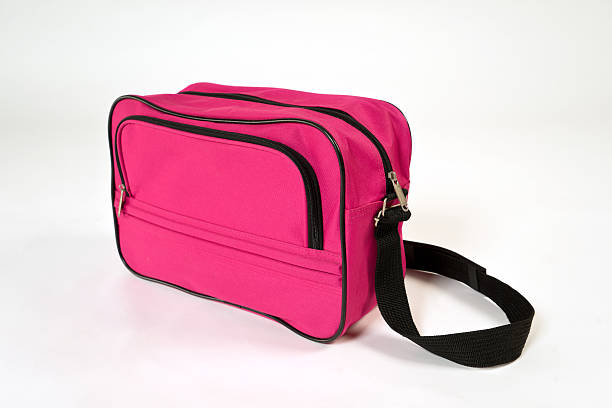 istock Pink bag with black shoulder straps 504788900