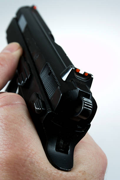 istock man pointing a weapon and weapon charges 504788936