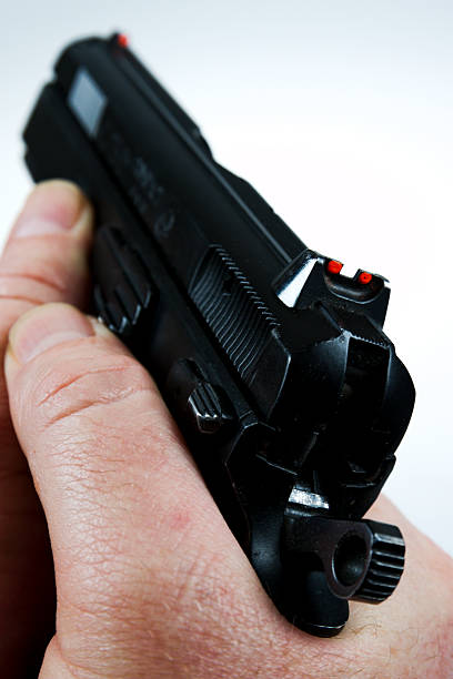 istock man pointing a weapon and weapon charges 504788996