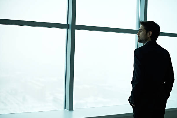 istock Businessman contemplating 504789134
