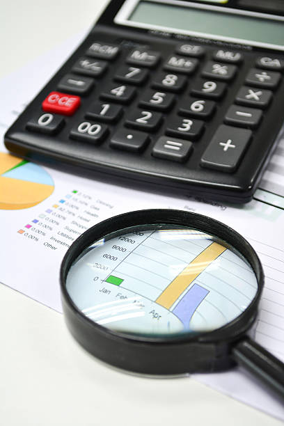 Business analytics. Calculator, financial reports stock photo