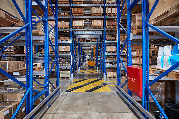 istock Ordered cardboard boxes on the shelves in the store. 504789494