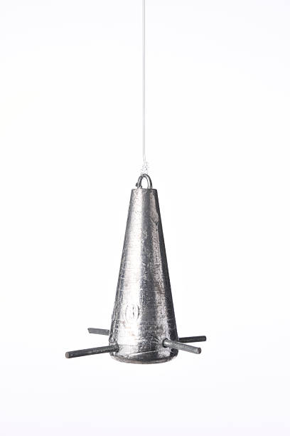 istock Isolated shot of lead spike sinker against white background 504791130