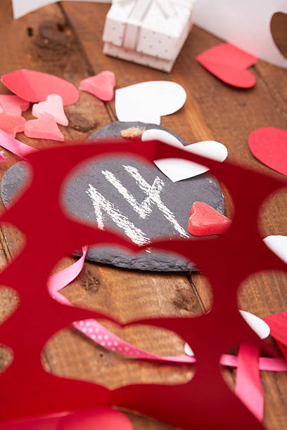 istock issue a gift, cut out hearts on Valentine's Day 504795530