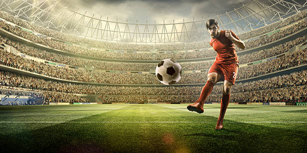 istock Football player kicking a ball 504796070