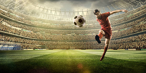 istock Football player kicking a ball 504796204