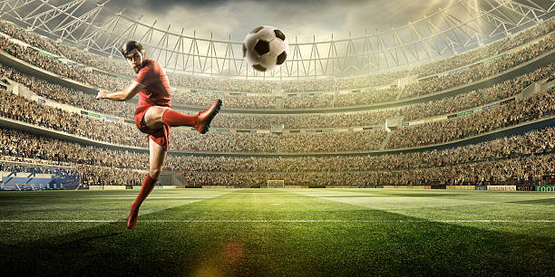 istock Football player kicking a ball 504796336