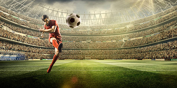 istock Football player kicking a ball 504796476