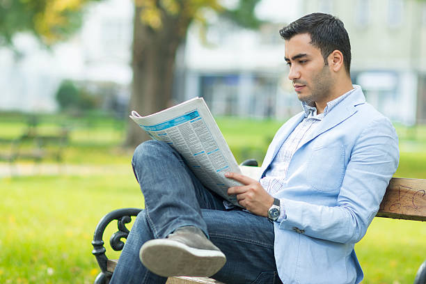 istock Young businessman with newspaper 504796724