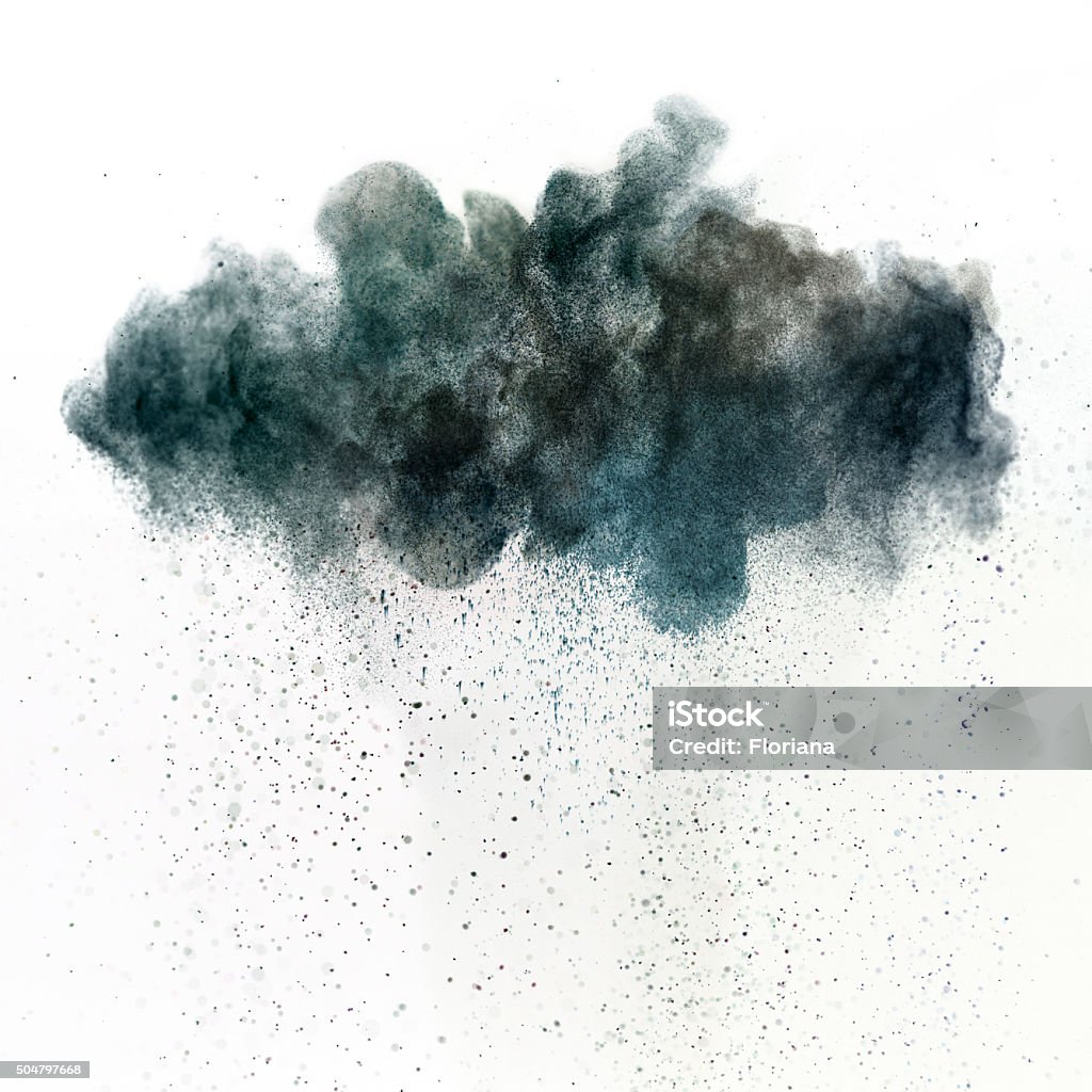Dark cloud of pollution Dark cloud of a toxic substance, metaphor for pollution or acid rain. Dark particles falling from the cloud. Studio shot using high speed technique.  Cloud - Sky Stock Photo