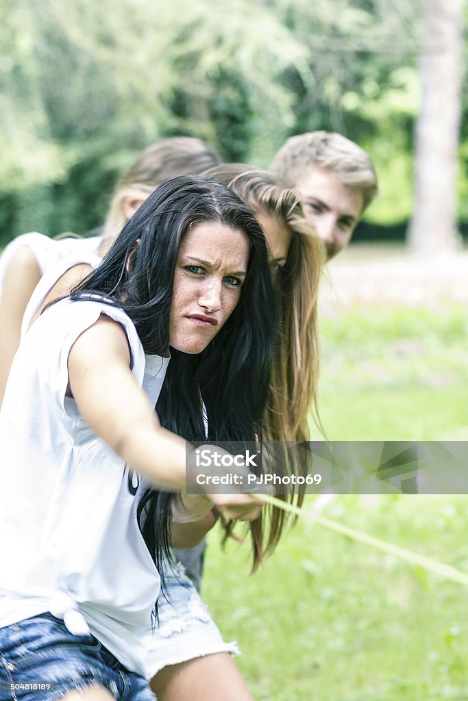 Group of friends playing Tug of war 20-29 Years Stock Photo