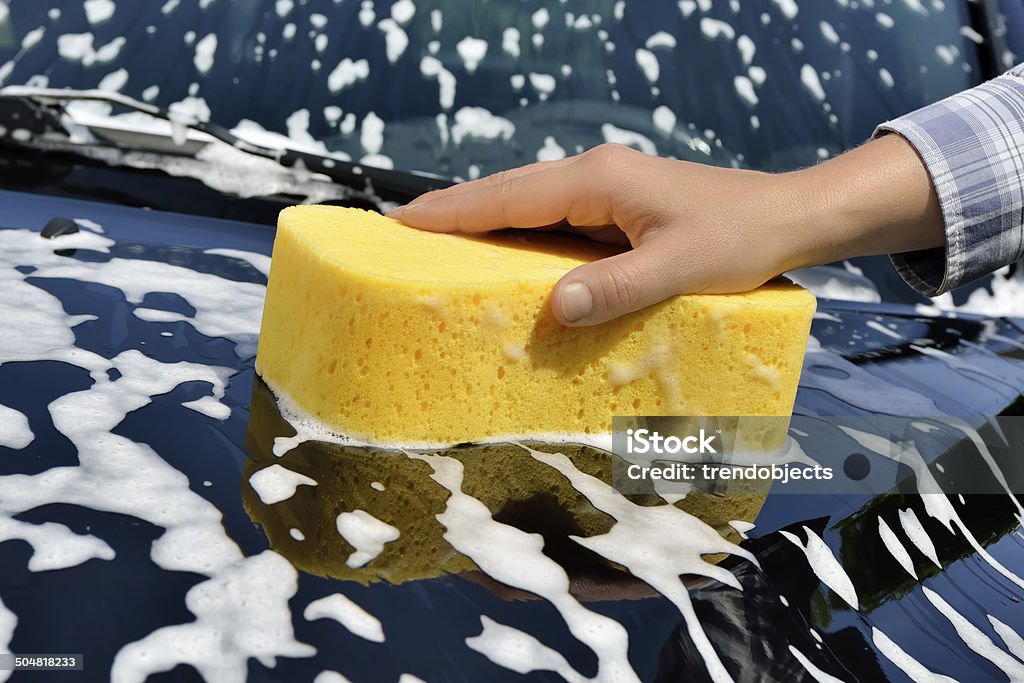Car Care - Washing a Car by Hand Washing a car with a sponge by hand. Car Stock Photo