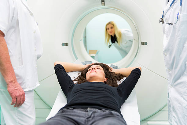 istock Chief radiologist,young doctors and  patient,having PET scan 504818967