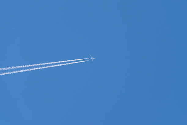 istock Airliner with two engines exhaust flying 504819212