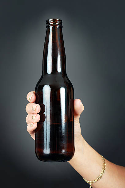 istock Woman hand holding beer 504819425