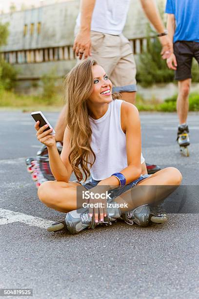 Young People On Rollerblades Stock Photo - Download Image Now - Roller Skate, 20-24 Years, Roller Skating