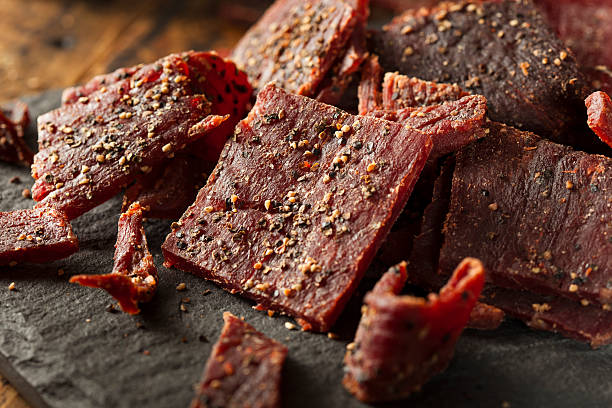 Dried Peppered Beef Jerky Dried Peppered Beef Jerky Cut in Strips beef stock pictures, royalty-free photos & images