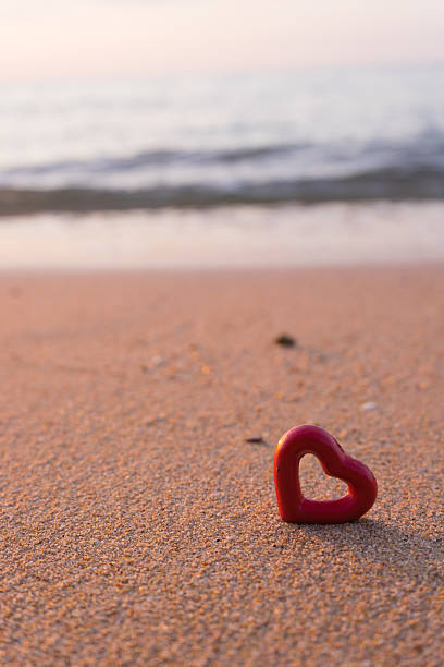 istock hearts on the summer beach soft focus 504820258