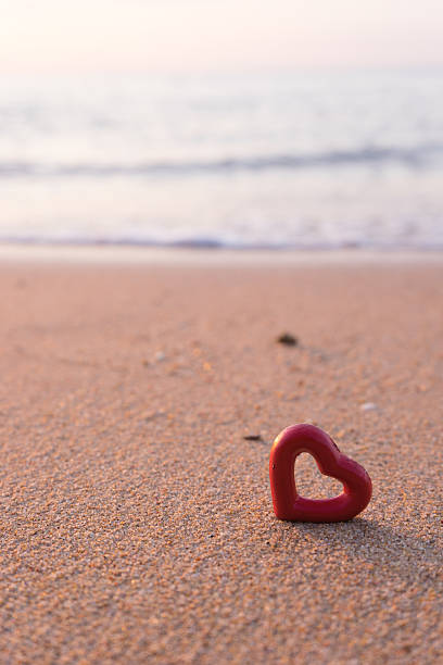 istock hearts on the summer beach soft focus 504820442