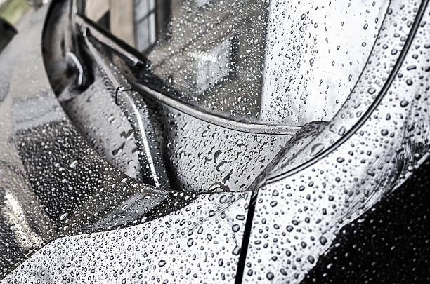istock Wet car hood fragment and windshield wipers 504820588