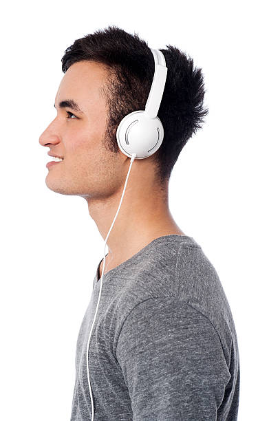 istock Handsome boy lost into musical world 504820745