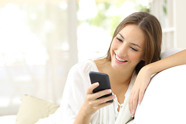 istock Girl reading message in a smart phone 504820804
