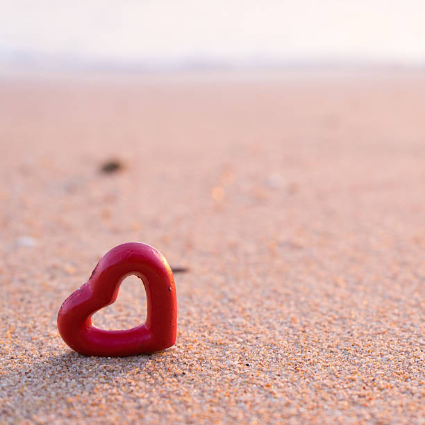 istock hearts on the summer beach soft focus 504820846