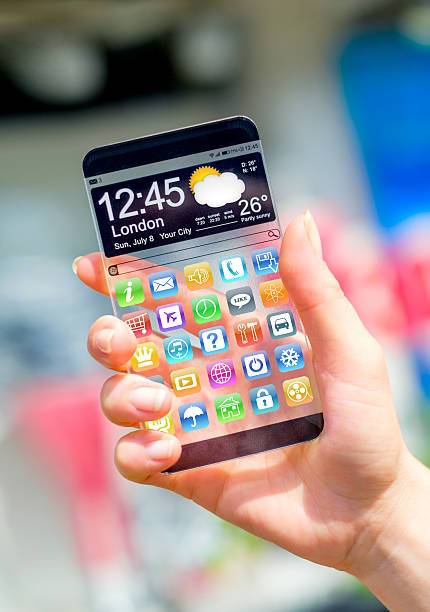 istock Smartphone with transparent screen in human hands. 504820875