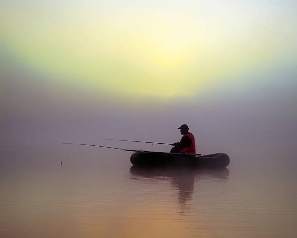 istock Fishermen on  boat in the fog 504821079