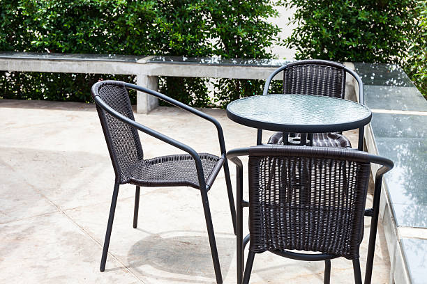 istock Striped table and wicker armchair 504821227